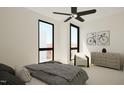 A bright bedroom featuring a ceiling fan, large windows, neutral decor and modern furnishings at 512 Gordon Street # 304, Durham, NC 27701