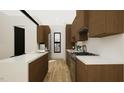Modern kitchen features white countertops, wood cabinets, and stainless steel appliances at 512 Gordon Street # 304, Durham, NC 27701