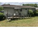 Backyard with a wooden deck and a ramp at 829 Coleman St, Raleigh, NC 27610
