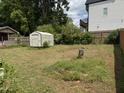 Spacious backyard featuring a storage shed at 829 Coleman St, Raleigh, NC 27610