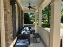 Relaxing covered front porch with comfortable seating, perfect for enjoying the outdoors at 1021 Golden Star Way, Wake Forest, NC 27587