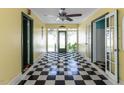 Bright entryway featuring black and white checkered flooring and doors leading to adjacent rooms at 110 W Parker St, Smithfield, NC 27577