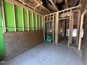 Interior view showcasing wooden frame construction and open space with green sheathing at 1521 1/2 Sunrise Ave, Raleigh, NC 27608