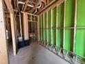 Framed interior construction featuring wooden studs, green sheathing and visible utility connections at 1521 1/2 Sunrise Ave, Raleigh, NC 27608