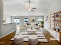 Bright living room features hardwood floors, vaulted ceiling, and stylish decor at 2079 Alderman Way, Creedmoor, NC 27522
