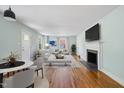Spacious living room boasting hardwood floors, a fireplace, and plenty of natural light at 2206 Guess Rd, Durham, NC 27705