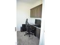 Functional office space with built-in desk, cabinets, and modern gaming chair at 2912 Epps Clark Rd, Siler City, NC 27344