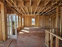 Interior view of exposed wood frame walls and ceiling of a new home with natural light at 3006 Dog Rose Dr # 308, Durham, NC 27703