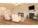 Comfortable living area with a fireplace, cozy seating, and wood-look flooring, perfect for relaxation at 3006 Dog Rose Dr # 308, Durham, NC 27703