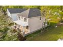 Charming home with a metal roofed front porch and manicured landscaping at 408 W Stallings St, Clayton, NC 27520