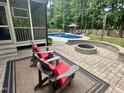 Relaxing patio area with comfortable seating and a cozy outdoor fire pit at 4405 Brighton Ridge Dr, Apex, NC 27539