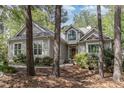 Charming home featuring light gray siding, a dark roof, and a beautiful arched window over the front door at 81008 Alexander, Chapel Hill, NC 27517