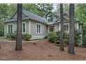 Charming home featuring light gray siding, a dark roof, and a beautiful arched window over the front door at 81008 Alexander, Chapel Hill, NC 27517