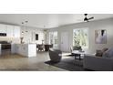 Bright open-concept living area featuring hardwood floors, recessed lighting, and a view to the outside at 1036 Harper Rd, Raleigh, NC 27603