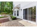 Charming townhome exterior with a private patio, lush greenery, and a fenced-in backyard at 11710 Mezzanine Dr # 101, Raleigh, NC 27614