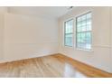 Bright living room with wood floors and natural light at 124 Owensboro Ct, Raleigh, NC 27603