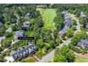 Aerial view of a property adjacent to a golf course, marked as 129 Trollingwood Dr at 129 Trellingwood Dr, Morrisville, NC 27560