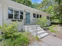 Exterior of a charming home with brick steps that lead to the front door, flanked by garden beds on either side at 1521 N Duke St, Durham, NC 27701