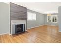 Bright living room featuring a cozy fireplace and beautiful hardwood floors at 1521 N Duke St, Durham, NC 27701