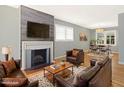 Spacious living room featuring a fireplace, hardwood floors, and cozy seating arrangement at 1521 N Duke St, Durham, NC 27701