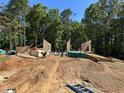 Framing stage of construction featuring lumber, ladder and construction workers on site at 188 Landon Ridge, Sanford, NC 27330
