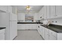 Bright kitchen featuring white cabinets, modern appliances, and stylish countertops at 1933 Castle Pines Dr, Raleigh, NC 27604