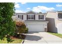 Inviting two-story home with a two-car garage and beautifully manicured landscaping at 208 Station Dr, Morrisville, NC 27560