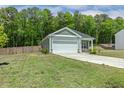 Attractive single-Gathering home with a two-car garage, lush lawn, and fenced yard for privacy at 230 Forest Meadow Ln, Franklinton, NC 27525