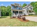 Charming two-story home with a welcoming front porch and well-maintained landscaping at 2407 Miriam Cir, Durham, NC 27704