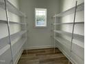 Spacious walk-in closet featuring ample shelving for storage at 253 Busterfield Ct, Benson, NC 27504