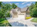 Attached three car garage with additional parking and a basketball hoop at 304 Villa Dr, Durham, NC 27712