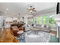 Open-concept living room featuring hardwood floors, recessed lights and a ceiling fan at 304 Villa Dr, Durham, NC 27712