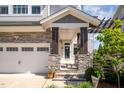 Covered front porch showing stone pillars and a pergola, with a glimpse of the front door at 79 Tarwick Ave, Chapel Hill, NC 27516