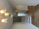 Hallway and stairway with wood flooring and white trim, leading to an upper level at 95 Black Walnut Dr # 191, Garner, NC 27529
