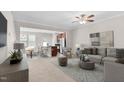 Cozy living room with modern furniture, ceiling fan, and an open view to the dining and kitchen area at 9805 Precious Stone Dr, Wake Forest, NC 27587