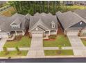 An aerial view of homes showcasing manicured lawns and complementing exterior colors at 1009 Middleground Cir, Durham, NC 27713