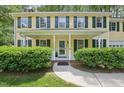 Inviting front porch with classic columns and lush landscaping for curb appeal at 106 Shady Point Ct, Durham, NC 27713