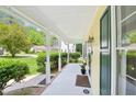 Spacious porch with ample seating and views of the surrounding greenery at 106 Shady Point Ct, Durham, NC 27713