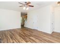 Spacious living room with wood-look floors and staircase access at 1307 Montreux Ct, Mebane, NC 27302