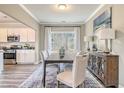 A formal dining area featuring a large window, modern furnishings, and decorative accents at 132 Sagamore Avenue, Angier, NC 27501
