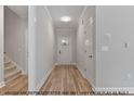 Bright entryway featuring hardwood flooring, neutral walls, and white trim at 1412 Sagamore Dr, Louisburg, NC 27549