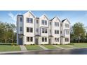 Brand new townhomes feature modern farmhouse exteriors, complemented by green lawns at 1538 Crescent Townes Way, Raleigh, NC 27604