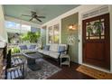 Cozy front porch with comfortable seating, a ceiling fan, and a stylish outdoor rug, perfect for relaxation at 2121 Karns Pl, Raleigh, NC 27614