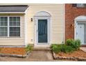 Close-up of the front entrance showcasing the architectural details and the welcoming doorway at 216 Climbing Ivy Ct, Cary, NC 27511