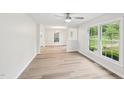 Bright dining area with hardwood floors and large windows showcasing the outdoor view at 2606 Newquay St, Durham, NC 27705