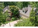Aerial view of a home surrounded by mature trees and lush landscaping at 27425 Walker, Chapel Hill, NC 27517