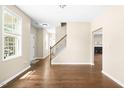 Open-concept living space with hardwood floors and abundant natural light at 317 Chamberlain Dr, Clayton, NC 27527