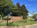 Sign for Riverwood Elementary School against a blue sky with trees at 317 Chamberlain Dr, Clayton, NC 27527