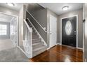 The home features a welcoming entryway with stairs to the second level and attractive hard wood flooring at 48 Arlington Dr, Cameron, NC 28326