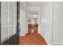 Bright foyer featuring hardwood floors, neutral walls, and a view into the living area at 524 Clarenbridge Dr, Cary, NC 27519